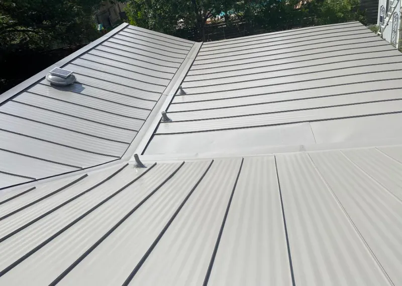 Solar attic fan installed on a metal roof for Roof Ventilation in Longboat Key